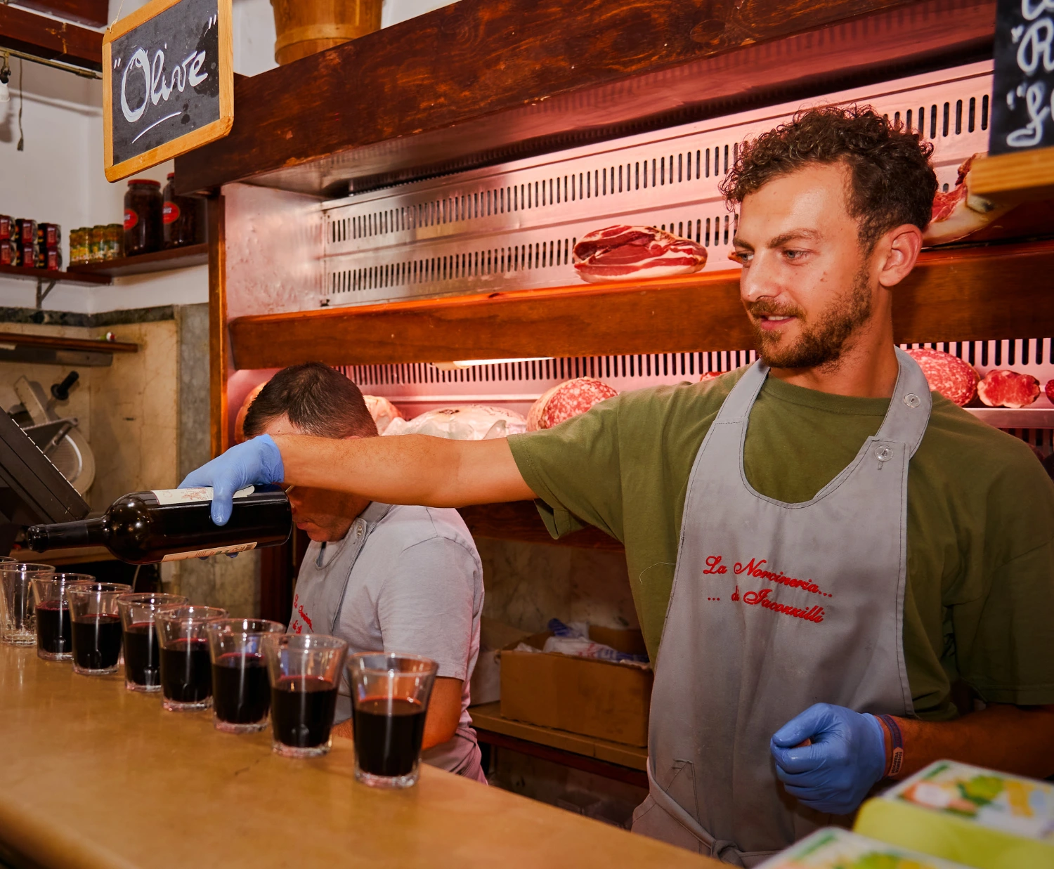 carpe-diem-tours-rome-food-tour-norcineria-red-wine-pouring-tasting